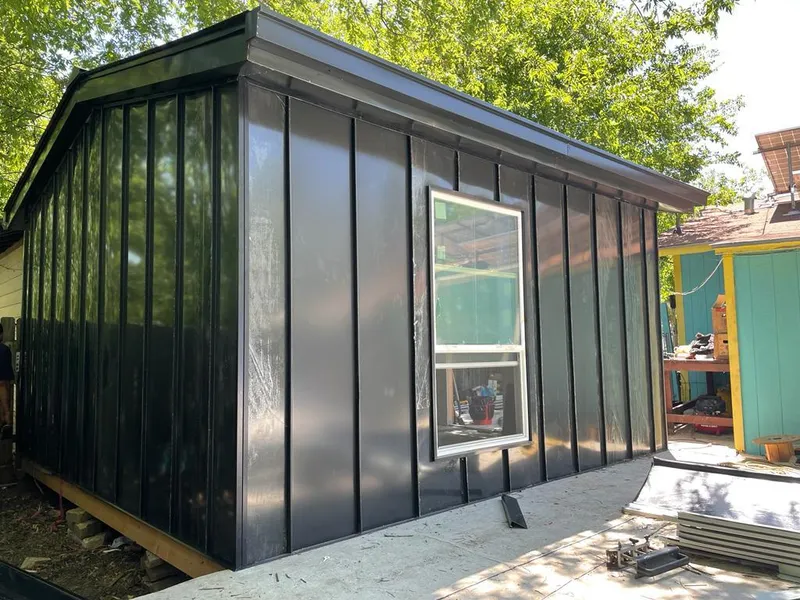 Black standing seam metal wall panels for Roof Inspection in Great Barrington